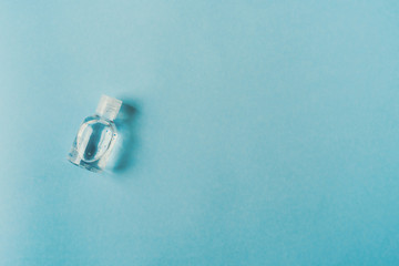 antibacterial gel bottle on a teal blue background. Prevent the coronavirus. Protection concept