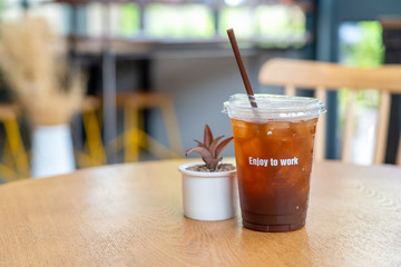 Americano coffee that was placed on a table at a coffee shop