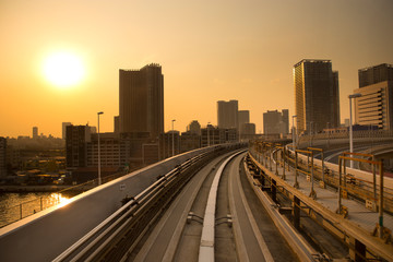 Fototapeta na wymiar Tokyo railway yamanote and skyline at sunset