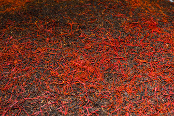 Raw Organic Red Saffron Spice in a Bowl.Luxurious flavour and expensive spices conceptual idea