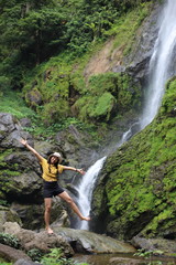 Women enjoying nature at Klong Lan waterfall in Klong Lan national park at Kamphaeng Phet, Thailand	