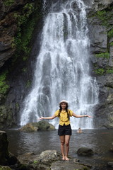 Fototapeta na wymiar Women enjoying nature at Klong Lan waterfall in Klong Lan national park at Kamphaeng Phet, Thailand 