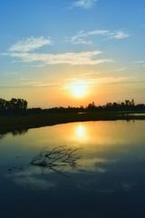 Obraz premium sunset over the river