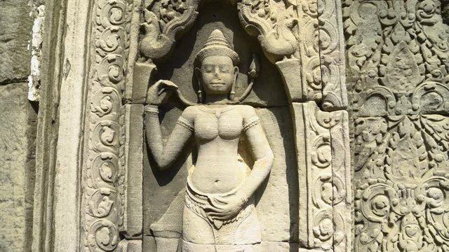 Khmer Temple Bas-Relief Stone Artwork of Apsara Dancer in Angkor Wat Complex in Siem Reap, Cambodia