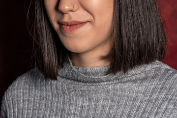 Close up of young woman with nose piercings