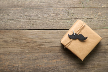 Happy father's day concept. Gift on a wooden background. Place for text