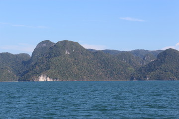 Fototapeta na wymiar Lush green hilly islands inside the sea in Langkawi, Malaysia