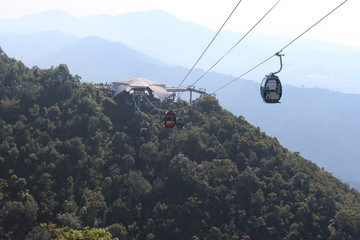 Cable cars in lush green mountains at Langkawi, Malaysia
