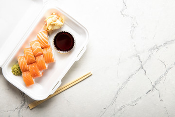 Box with rolls Philadelphia soy sauce and wasabi. Japanese kitchen. Food delivery.