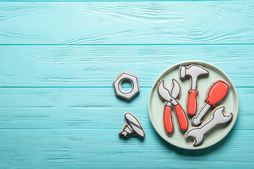 Happy father's day concept. Plate with cookies on a wooden background. Place for text.