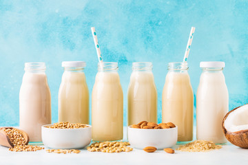 Obraz na płótnie Canvas A bottles of alternative milk and ingredient