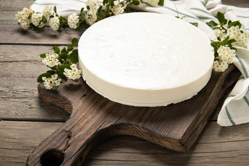 Tasty homemade cheesecake on a wooden background. Place for text.