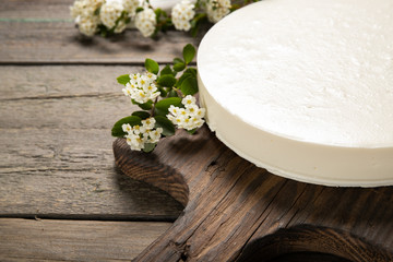 Tasty homemade cheesecake on a wooden background. Place for text.