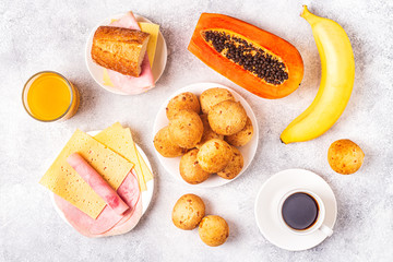 Traditional Brazilian breakfast - cheese bread, coffee, ripe fruit.