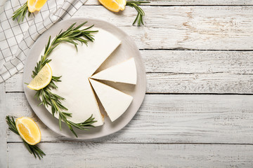 Delicious Homemade Cheesecake Decorated with Lemons and Rosemary