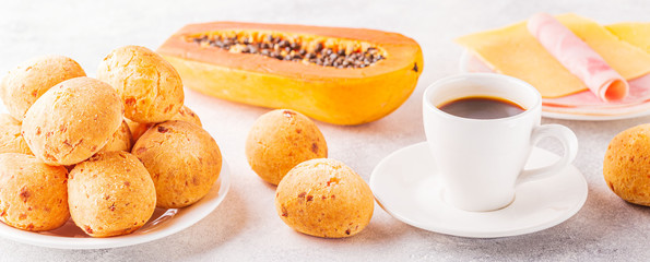 Traditional Brazilian breakfast - cheese bread, coffee, ripe fruit.