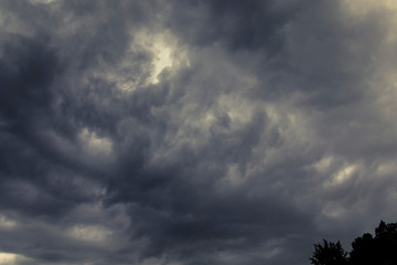 A menacing stormy cell forms a beautiful, dark and scary cloud in the sky