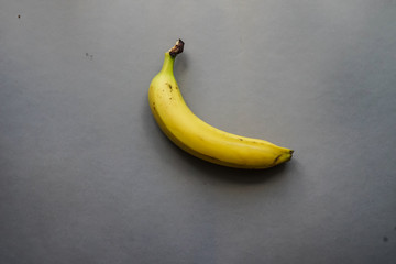 Banana on gray tbackground