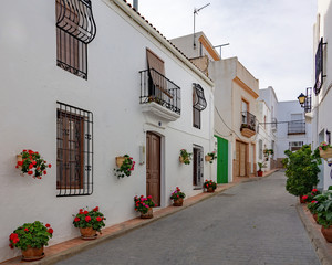 Streets of a white town called Lucainena de las Torres in Spain. Some flowers and balconies.