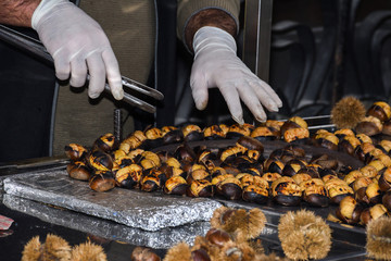 Roasting chestnuts on a street stall in Istanbul, Turkey. Selective focus.