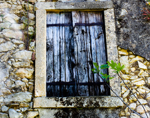 wooden window with fig leaves