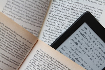 Fototapeta premium paper books and an e-book reader