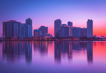 Obraz premium beautiful sunrise city cityscape buildings skyline miami florida brickell key downtown architecture skyscraper impressions sky panorama reflection sunset blue