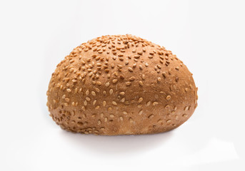 Fresh fragrant bun for burgers with sesame seeds on a white background. Can be used for advertising