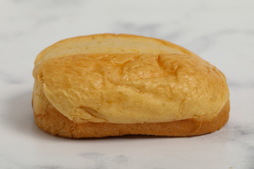 Breakfast buns on white marble background. Sweet brioche