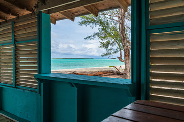 View of Coco Plum beach from the window of a small wooden house (Great Exuma,  Bahamas).