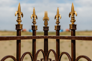 Decorative fence. Wrought iron fence with decorative arrows.