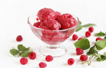 homemade ice cream raspberry sorbet in kremanke and fresh raspberries on a light background. place for text. copy space