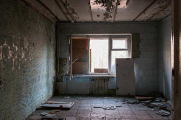 abandoned hotel building. abandoned room with cracked walls and peeling paint. broken windows, horror interior. 
