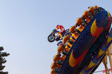 A architecture of man riding motorcycle in an entertainment theme park