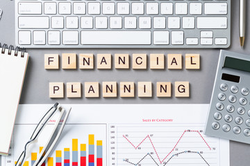 Financial planning concept with letters on cubes