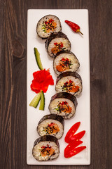 Korean roll Gimbap(kimbob). Steamed white rice (bap) and various other ingredients. Trendy black background