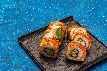 Grilled tiger prawn sushi. Japanese or Korean roll with different fresh ingredients. Nautical background