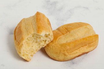 Breakfast buns on white marble background. Sweet brioche