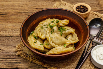 Dumplings stuffed stewed cabbage and sour cream. Traditional Ukrainian dish varenyky