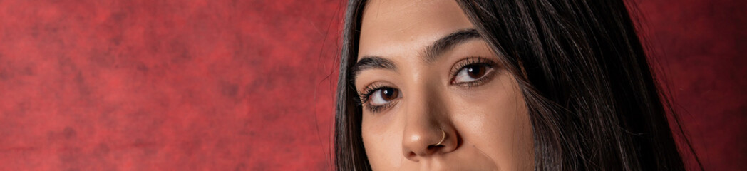 close up of young woman with brown eyes.