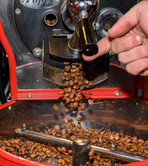 Antique coffee grinder with coffee beans, various types: dark black, brown, green specialty