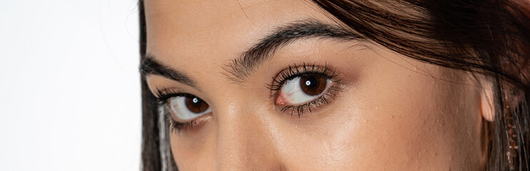 Obraz premium close up of young woman with brown eyes.