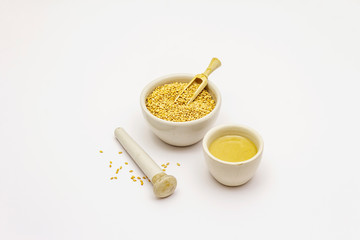 Tahini with sesame seeds isolated on white background