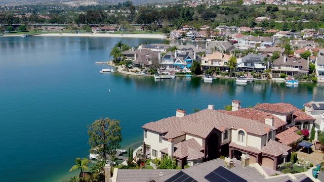 Aerial view of Lake Mission Viejo, with recreational facilities, surrounded by private residential and condominium communities. Orange County, California, USA