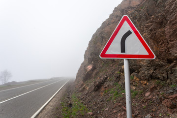 Sharp turn warning road sign