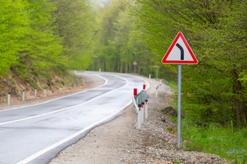 Sharp turn warning road sign