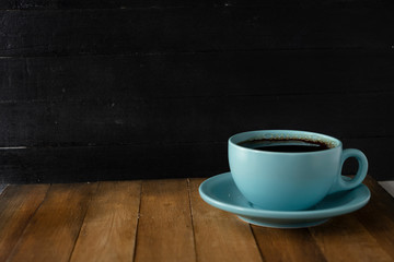 blue coffee cup with black background