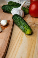 
Green cucumber and Vegetables for making pizza. Ready free space for text.