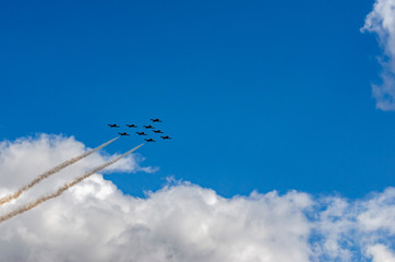  Silhouetted nine jet fighter formation