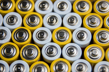 The batteries stand close together and form a beautiful background. Selective focus. Artistic...